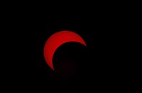 Partial Solar Eclipse (red sun) by Phillip Jones - various sizes