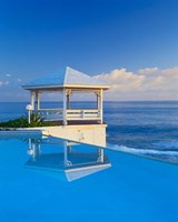 Gazebo reflecting on pool with sea in background, Long Island, Bahamas Fine Art Print
