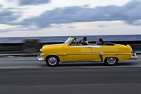 1950's era car in motion along the Malecon or seawall, Havana, Cuba Fine Art Print