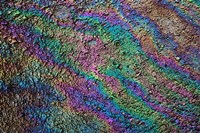 Motor oil creating rainbow pattern on pavement, Havana, Cuba Fine Art Print