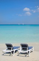 Sand and beach chairs await tourists, Varadero, Cuba Fine Art Print