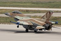 An F-16C Barak of the Israeli Air Force landing at Hatzor Air Force Base Fine Art Print