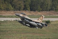 An F-16C Barak of the Israeli Air Force taking off from Hatzor Air Force Base Fine Art Print