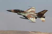 An F-16B Netz of the Israeli Air Force in flight over Israel Fine Art Print