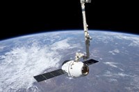 The SpaceX Dragon Cargo Craft in the Grasp of the Canadarm2 Fine Art Print