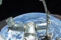 A portion of the International Space Station against Earth's horizon Fine Art Print