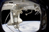 The docked Space Shuttle Discovery and Dextre Fine Art Print