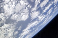 A Blue and White part of Earth and the Blackness of Space Viewed from the Earth-Orbiting Space Shuttle Atlantis - various sizes