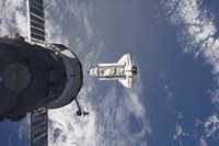 Space Shuttle Atlantis and a Russian Spacecraft backdropped by a Blue and White Earth Fine Art Print