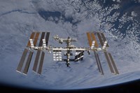 International Space Station set against the background of a cloud covered Earth Fine Art Print