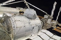 The Pressurized Mating Adapter 3 in the Grasp of the Canadarm2 Fine Art Print