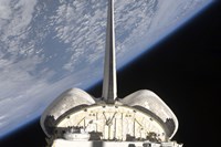 A partial view of Space Shuttle Endeavour Backdropped by Earth's horizon - various sizes