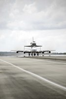 Space shuttle Discovery Sits Atop the Boeing 747 Shuttle Carrier Aircraft Fine Art Print