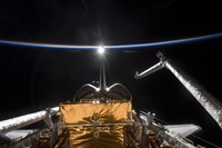 Space Shuttle Atlantis' Payload Bay Backdropped by a Blue and White Earth Fine Art Print