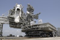 The mobile Launcher Platform is being moved via the Crawler-Transporter Underneath Fine Art Print
