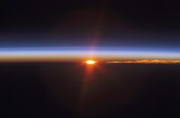 Layers of Earth's atmosphere, brightly colored as the sun sets over South America Fine Art Print