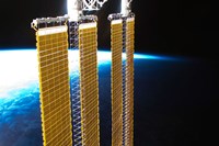 A Partial View of International Space Station Solar Panels and Earth's Horizon Fine Art Print