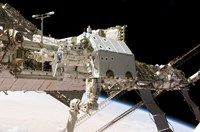 The Canadian-Built Dextre Robotic System in the Grasp of the Robotic Canadarm2 Fine Art Print