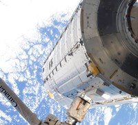 The Kibo Japanese Pressurized Module in the Grasp of the Robotic Canadarm2 Fine Art Print