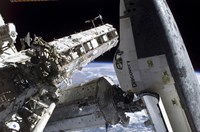 Space Shuttle Discovery Docked to the International Space Station Fine Art Print