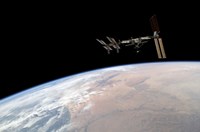 International Space Station Over Earth Fine Art Print