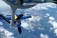 A KC-135 Stratotanker refuels an F/A-18 Hornet Fine Art Print
