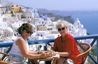 Women Having Coffee on Cafe Terrace, Santorini, Greece Fine Art Print