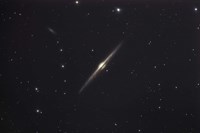 NGC 4565, an edge-on unbarred spiral galaxy in the Constellation Coma Berenices Fine Art Print
