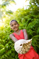 Village boy with large sea shell, Beqa Island, Fiji Fine Art Print