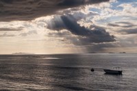 Dramatic light over a little boat, Mamanucas Islands, Fiji, South Pacific Fine Art Print