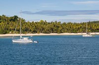 Little sailboat in the blue lagoon, Yasawa, Fiji, South Pacific Fine Art Print