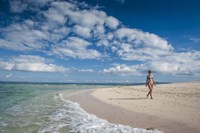 Woman walking on white sand beach of Beachcomber Island, Mamanucas Islands, Fiji Fine Art Print