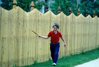 1980s Smiling Boy Running Along Sidewalk Fine Art Print
