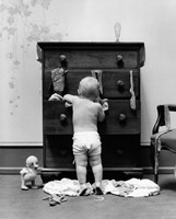1940s Toddler Baby Pulling Clothes Out Of Bureau Fine Art Print