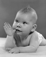 1950s Baby Lying On Stomach With Thumb In Mouth Fine Art Print