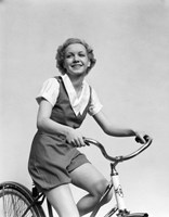 1930s Smiling Blonde Woman Riding Bicycle Fine Art Print