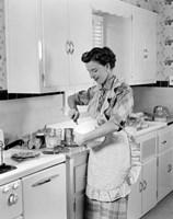 1950s Housewife In Kitchen Mixing Ingredients Fine Art Print
