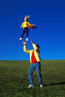 1990S Father Tossing Daughter Up In The Air Fine Art Print