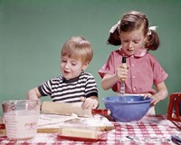 1960s  Boy And Girl Mixing Ingredients For Cookies Fine Art Print