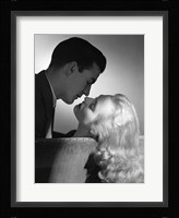 Movie Star Studio Style Romantic Couple Embracing On Sofa About To Kiss Fine Art Print