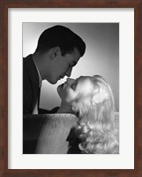 Movie Star Studio Style Romantic Couple Embracing On Sofa About To Kiss Fine Art Print