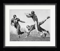 Three Men Playing Football Fine Art Print
