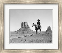 Navajo Indian In Cowboy Hat On Horseback With Monument Valley Rock Formations In Background Fine Art Print