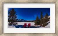 Red Chairs Under a Moonlit Winter Sky at Two Jack Lake Fine Art Print