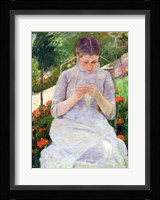 Young Woman Sewing in the garden Framed Print