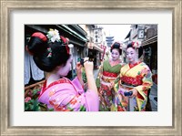 Three geishas, Kyoto, Honshu, Japan (taking pictures) Fine Art Print