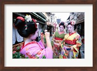 Three geishas, Kyoto, Honshu, Japan (taking pictures) Fine Art Print