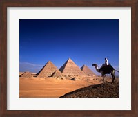 Riding a camel near pyramids, Giza Pyramids, Giza, Egypt Fine Art Print