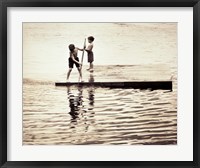 Two boys standing on a wooden platform in a lake Fine Art Print