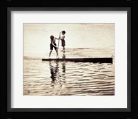 Two boys standing on a wooden platform in a lake Fine Art Print